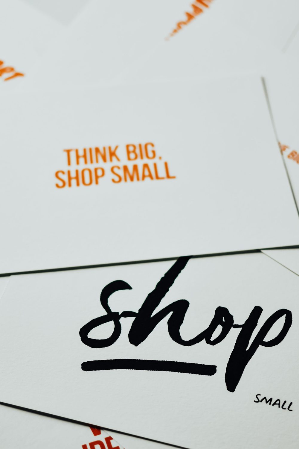Printed cards fanned out on a pale surface